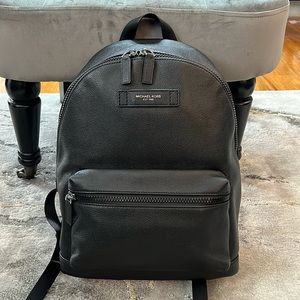 Gently used Michael Kors black pebbled leather backpack.